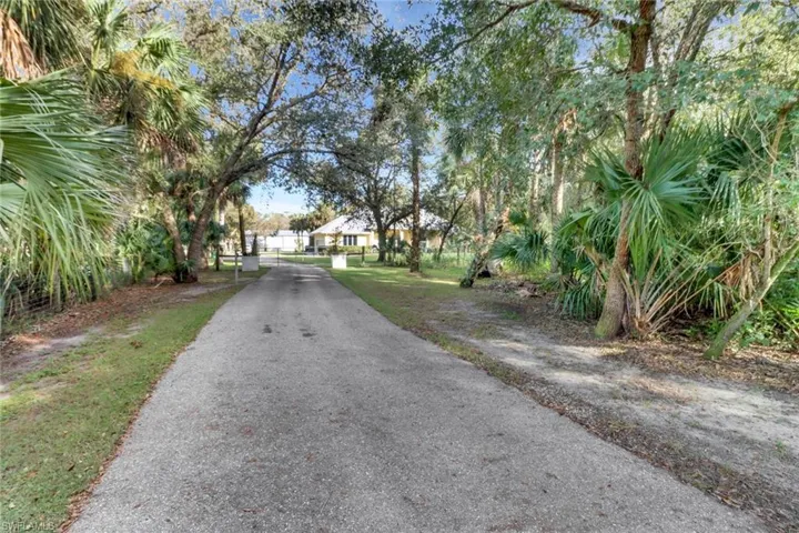 Private paved driveway to gated home