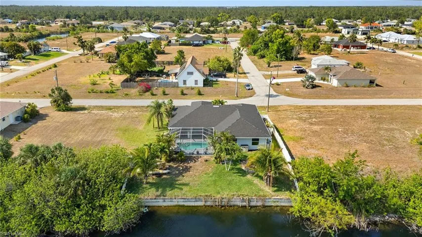 Drone / aerial view featuring a water view and a residential view