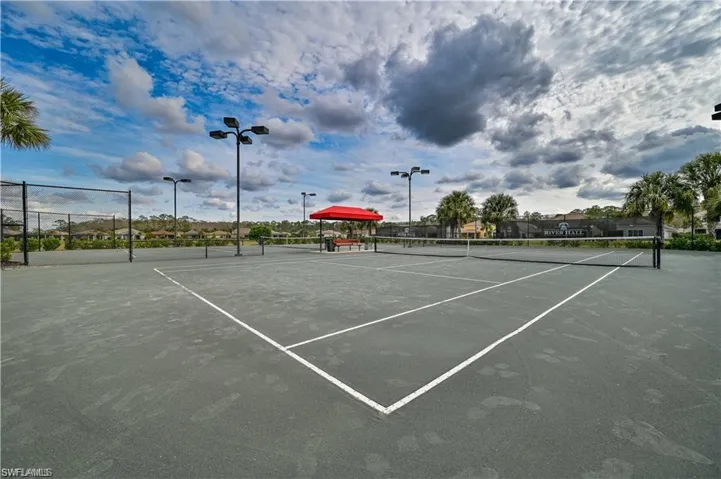 View of tennis court with fence