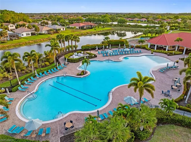 Community pool featuring a water view