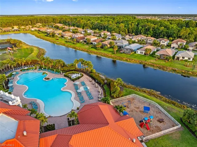 Aerial perspective of suburban area with a nearby body of water