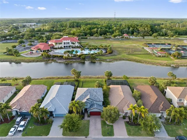 Aerial view of residential area featuring a large body of water