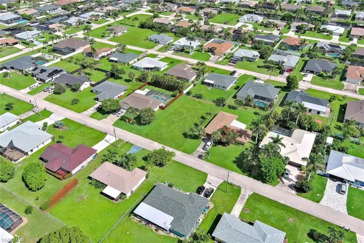 Aerial overview of property's location featuring nearby suburban area