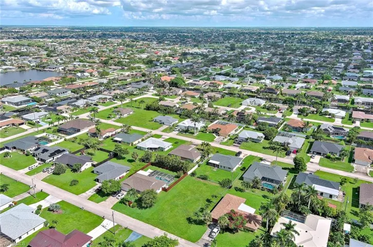 View of property location with nearby suburban area and a large body of water