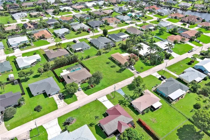 View of property location with nearby suburban area