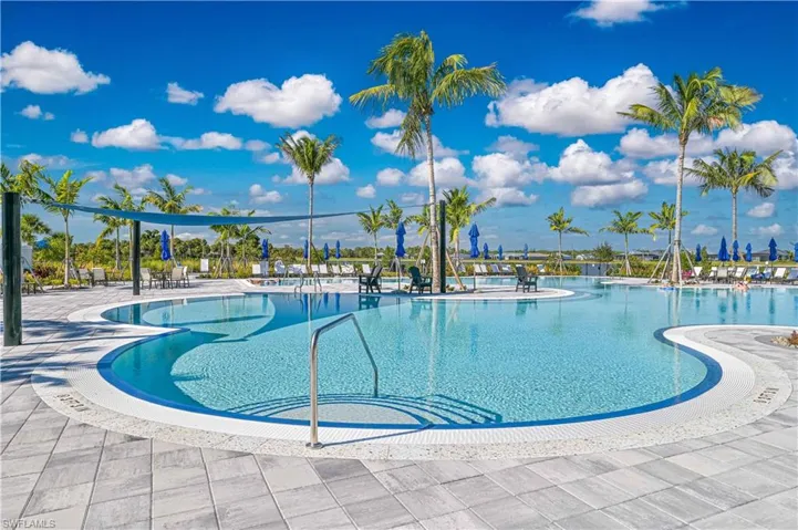 Community pool with a patio