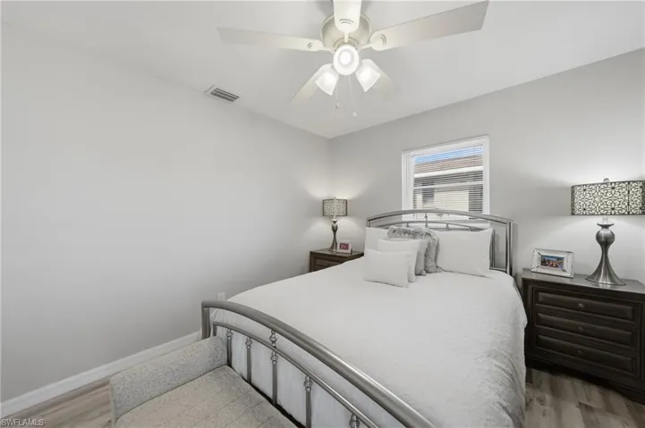 Bedroom featuring light wood-type flooring and a ceiling fan