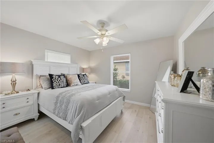 Bedroom featuring light wood-type flooring and ceiling fan