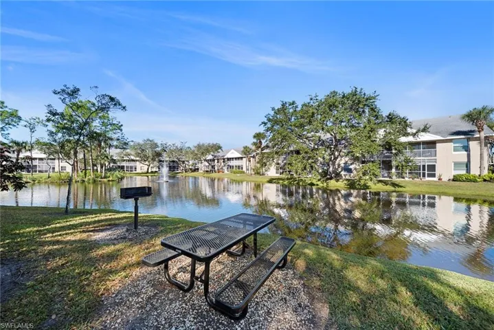 View of home's community featuring a yard, a water view, and a residential view