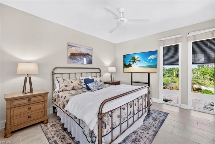 Bedroom featuring a ceiling fan and light tile patterned floors
