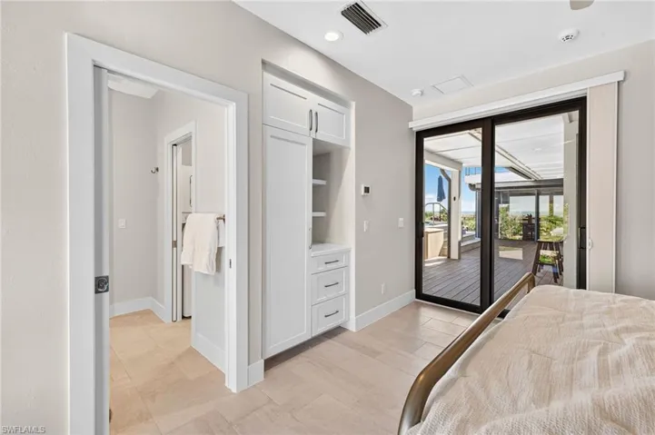 Bedroom with recessed lighting and access to outside