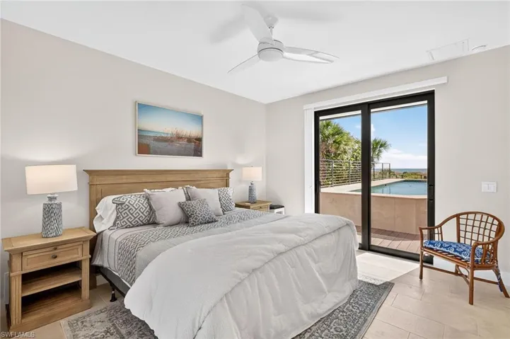 Bedroom featuring access to exterior and ceiling fan