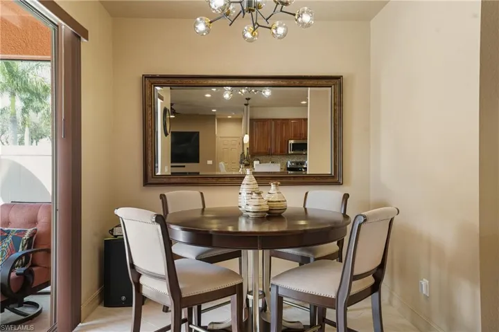 Dining area with baseboards and a notable chandelier