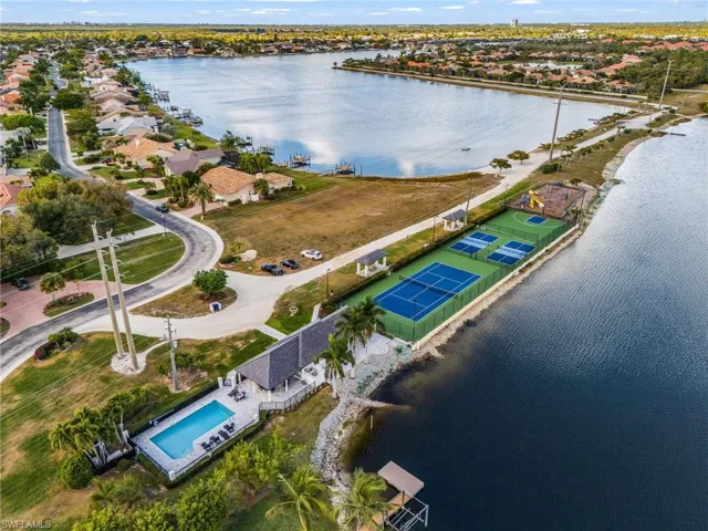 Aerial view of clubhouse, sports courts, swimming pool