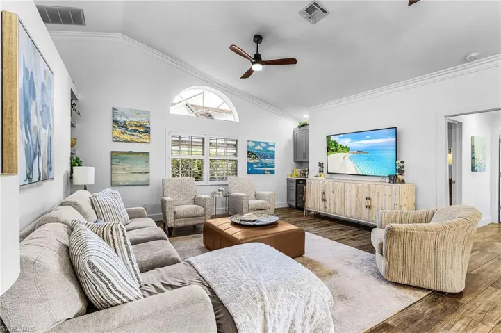 Living area with high vaulted ceiling