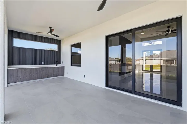 View of patio with ceiling fan