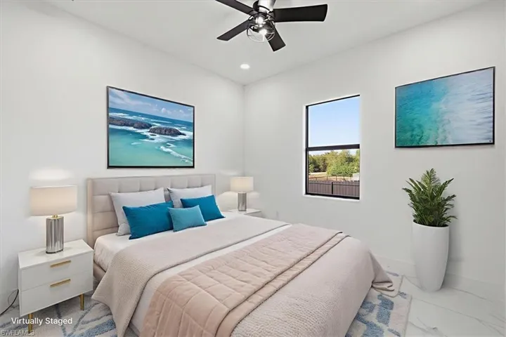 Bedroom with ceiling fan, recessed lighting, and marble finish floors
