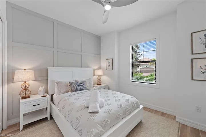 Bedroom with light wood-type flooring and a ceiling fan