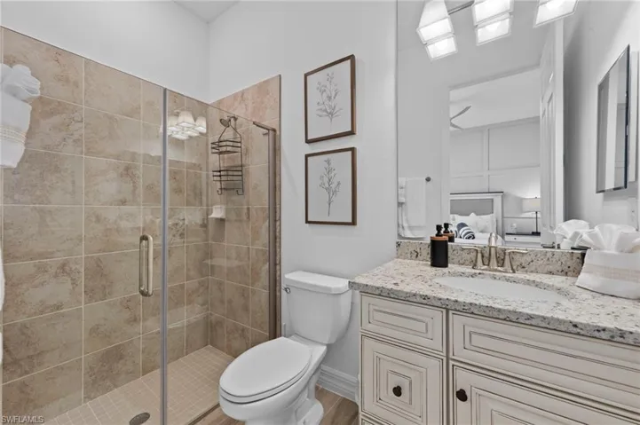 Ensuite bathroom with vanity and a shower stall