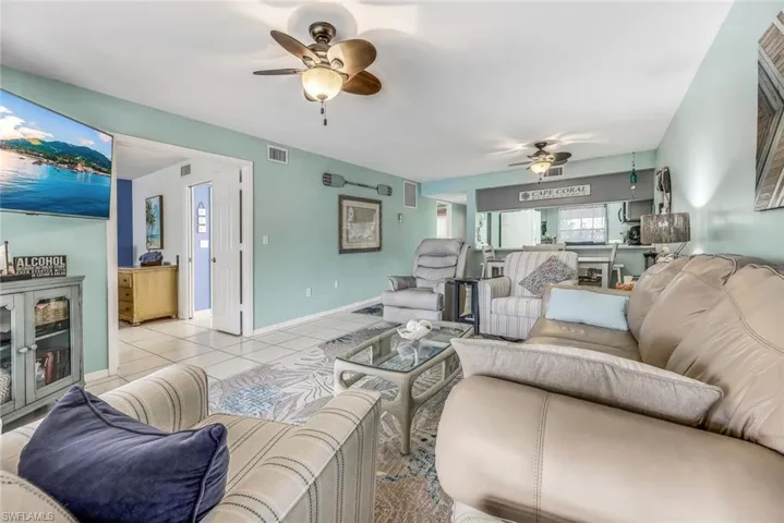 Tiled living room with ceiling fan