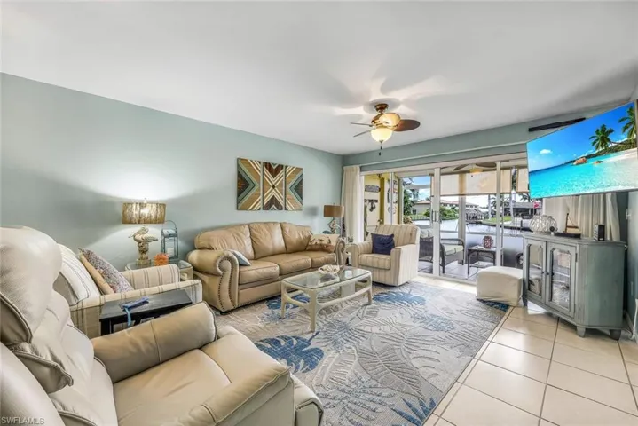 Tiled living room with ceiling fan