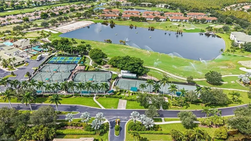 View of property location featuring a large body of water and nearby suburban area