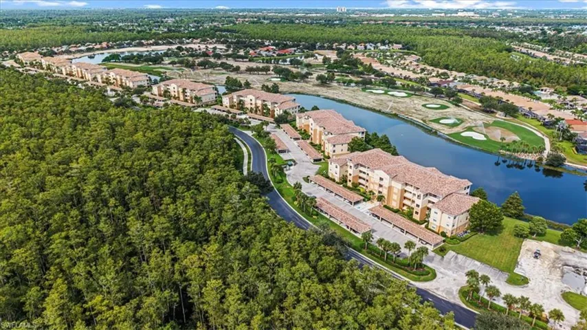 View of property location featuring a large body of water and a local golf course