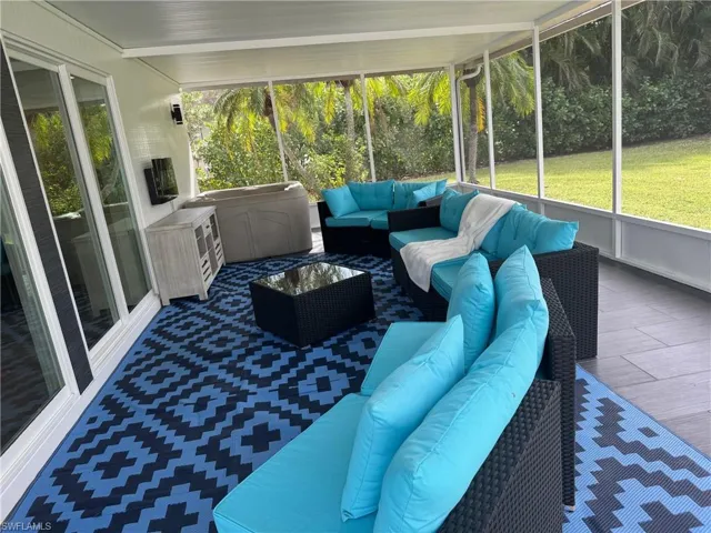 Sunroom / solarium featuring outdoor lounge area