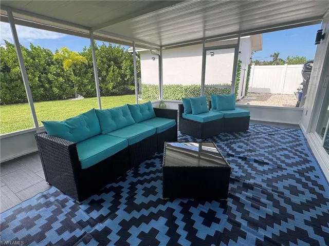 Sunroom featuring wood style floor tile