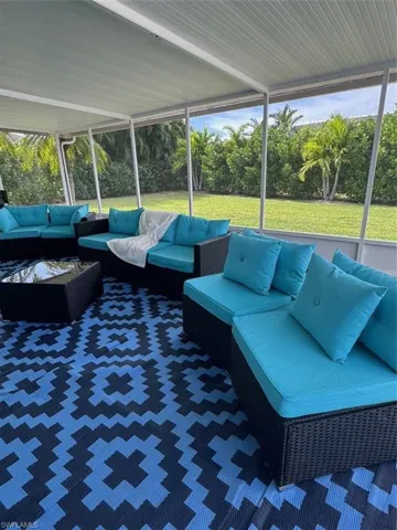 Sunroom featuring outdoor lounge area