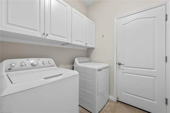 Laundry room with cabinets