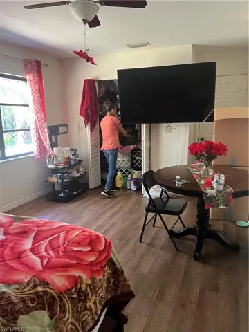Bedroom featuring wood finished floors and a ceiling fan