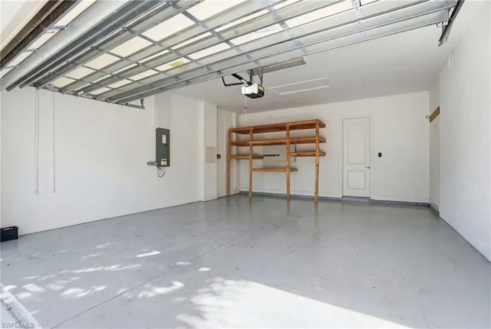 Garage featuring electric panel
