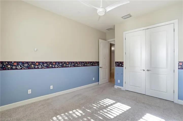 Unfurnished bedroom featuring carpet floors and a closet