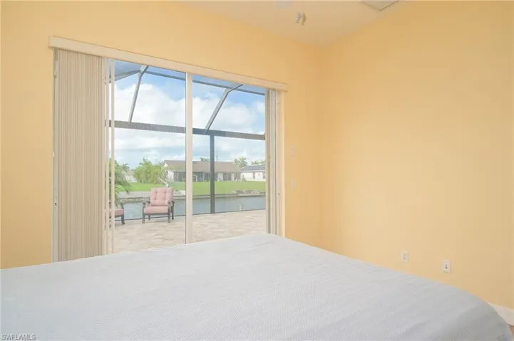 Unfurnished bedroom featuring a water view