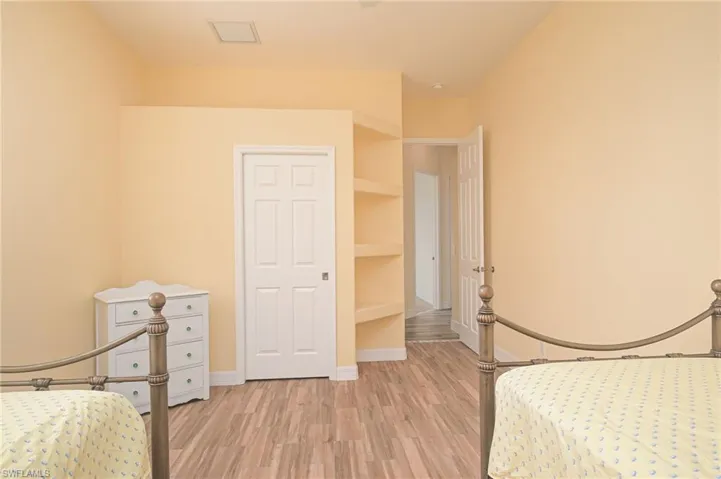 Unfurnished bedroom with light hardwood / wood-style floors