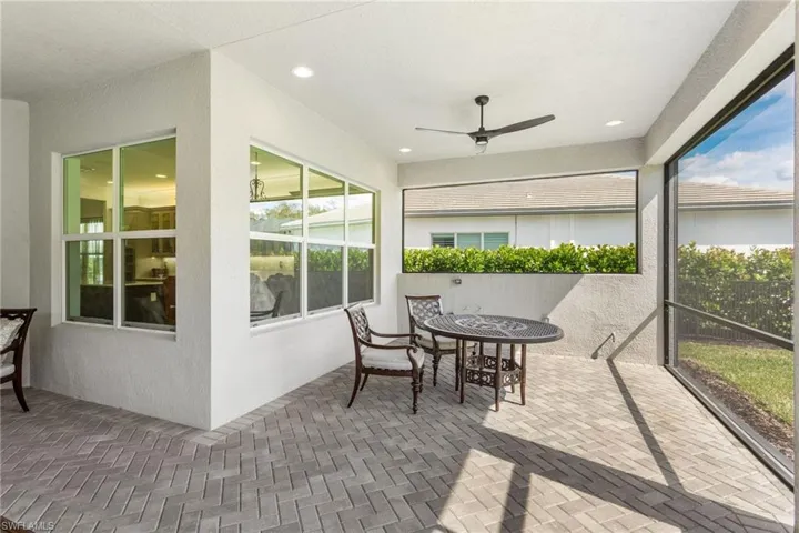 covered lanai featuring a ceiling fan and outdoor dining space. Plumbed for Outdoor Kitchen