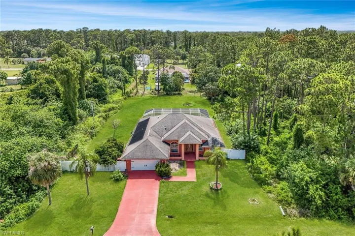 View from above of property with a heavily wooded area