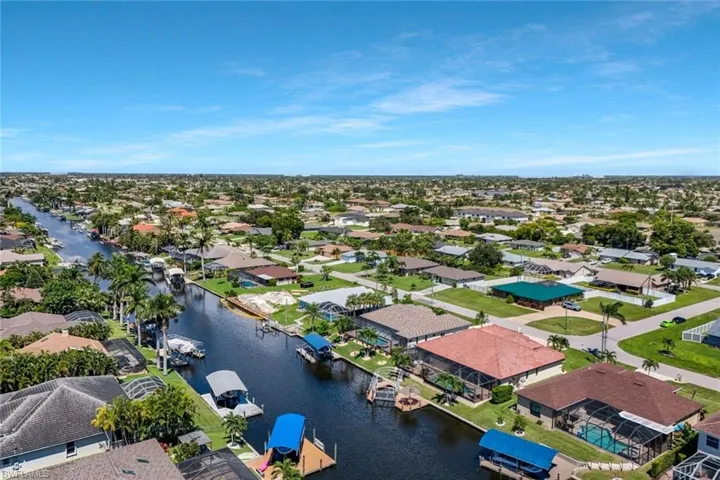 Aerial view of residential area with a nearby body of water