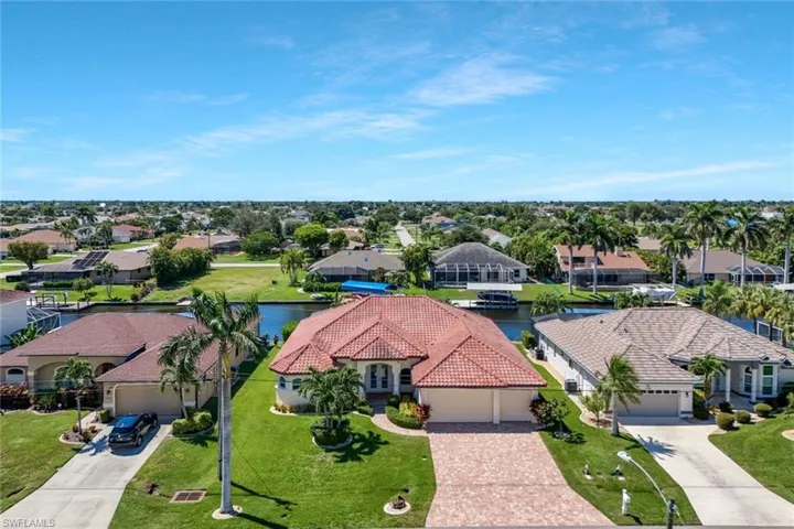 Aerial perspective of suburban area with a large body of water
