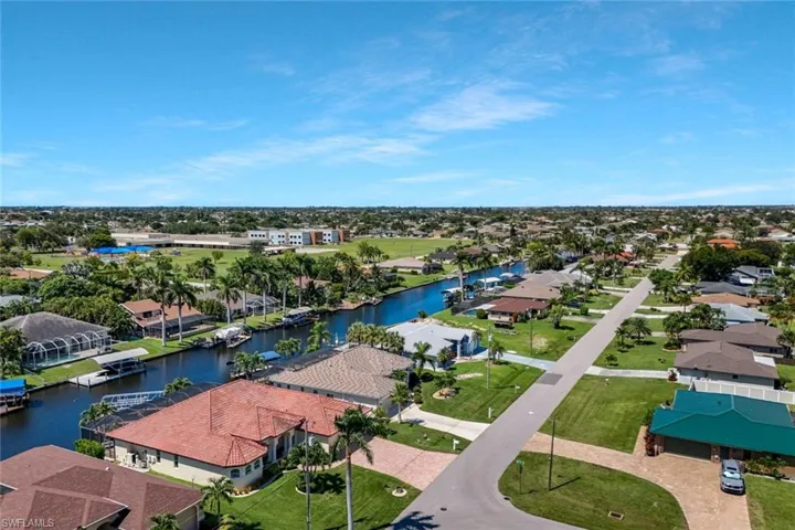 Aerial view of residential area featuring a large body of water