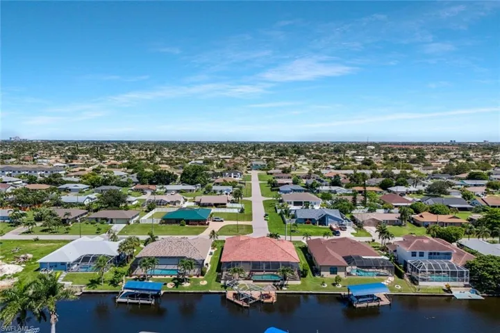 Aerial perspective of suburban area with a large body of water