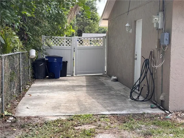 Extra cement slab adjacent to garage @n accessible thru gate