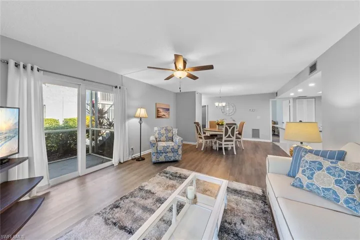 Living room featuring hardwood / wood-style floors and ceiling fan
