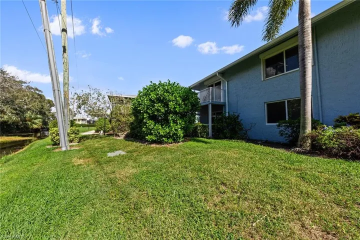 View of yard featuring a balcony