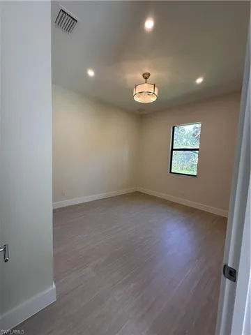 Empty room featuring recessed lighting and light wood finished floors