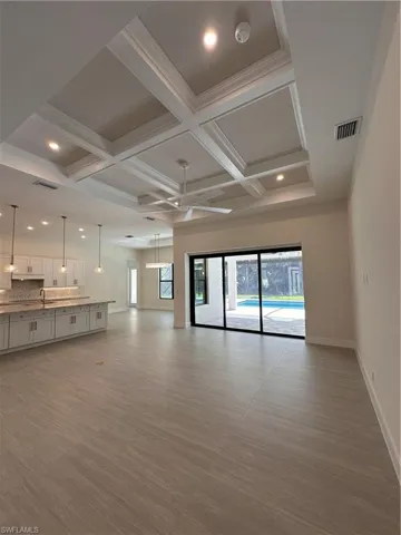 Expansive open-concept living area thoughtfully designed to blend indoor and outdoor living. The spacious great room seamlessly integrates with the gourmet kitchen, creating an ideal setting for both everyday living and entertaining.