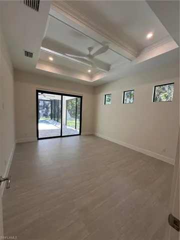 Primary Bedroom with pool and patio view
