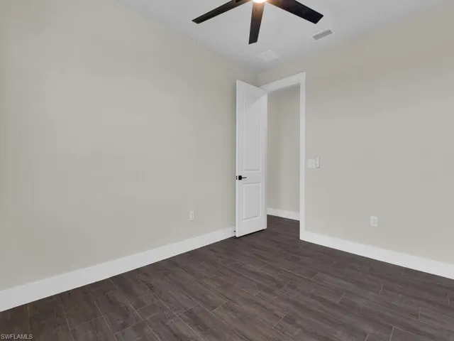 Unfurnished bedroom featuring light wood-style flooring, ceiling fan, and a closet