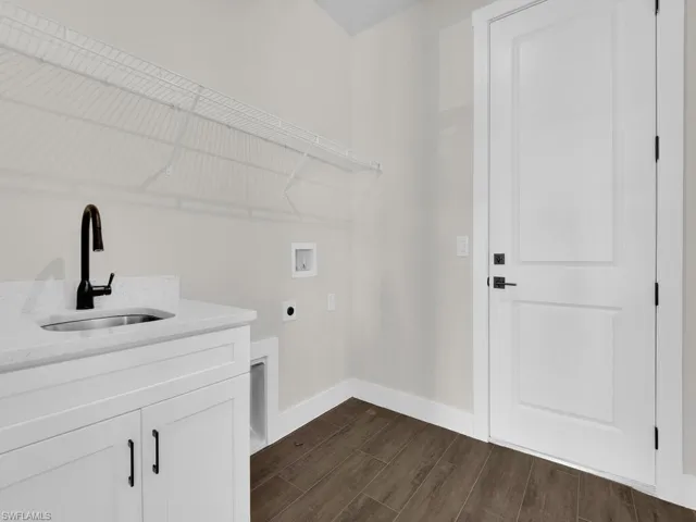 Empty room featuring wood tiled floors and ceiling fan